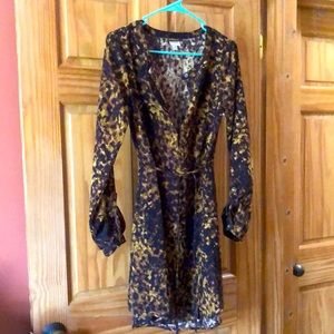 Long sleeve Tortoise color pattern dress with string/loops for waist. Button up.